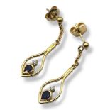 A PAIR OF VINTAGE 18CT GOLD, SAPPHIRE AND DIAMOND EARRINGS The pear cut sapphire set with two