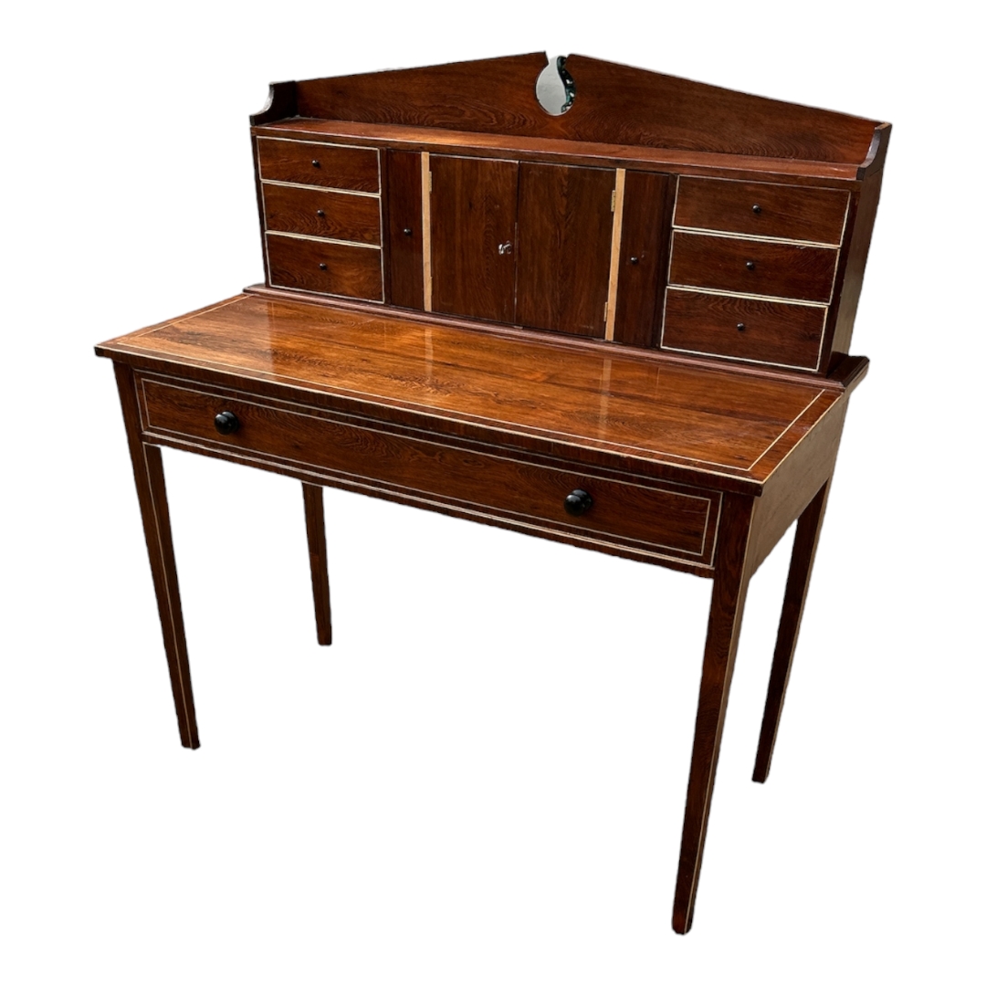 A 20TH CENTURY BESPOKE MAHOGANY WRITING TABLE The architectural back gallery with central cupboard