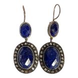 A PAIR OF WHITE METAL DIAMOND AND LAPIS LAZULI EARRINGS Having a cabochon cut lapis stone edged with