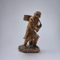 A FINE JAPANESE MEIJI PERIOD, 1868 - 1911, WOODEN CARVING, FARM LABOURER Wearing a Japanese