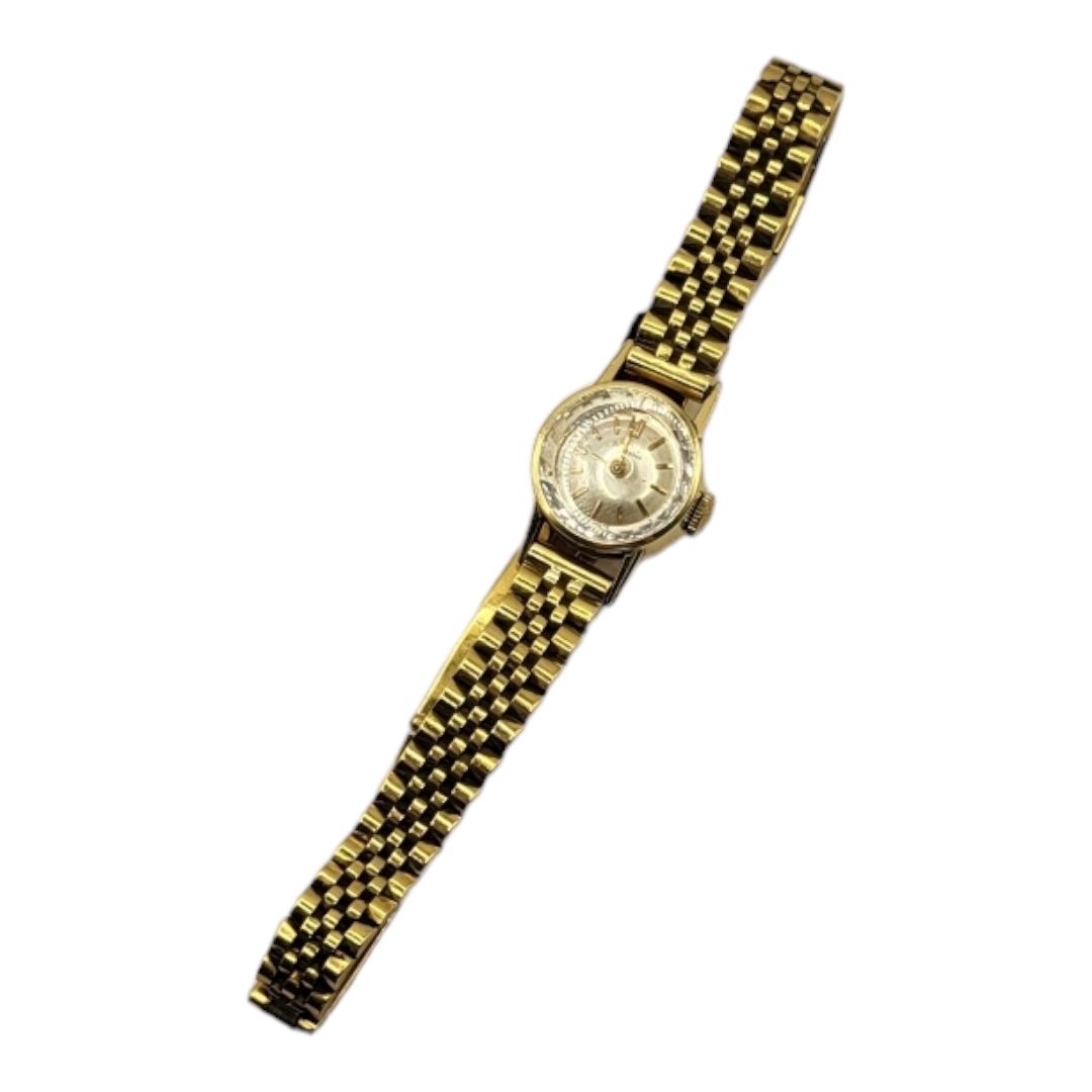 GIRARD PERREGAUX, A VINTAGE YELLOW METAL LADIES’ WRISTWATCH Silver tone dial on a yellow metal