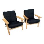 GETAMA, HANS J. WAGNER, DANISH, A PAIR OF OAK OPEN EASY ARMCHAIRS With black fabric upholstered