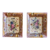 A PAIR OF SEVRÈS STYLE CERAMIC CIGAR ASHTRAYS With floral decoration and raised gilt borders,