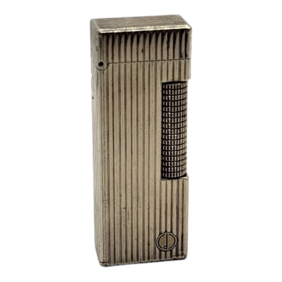 DUNHILL, A VINTAGE WHITE METAL CIGARETTE LIGHTER Reeded case marked number 22385, in Dunhill box. (