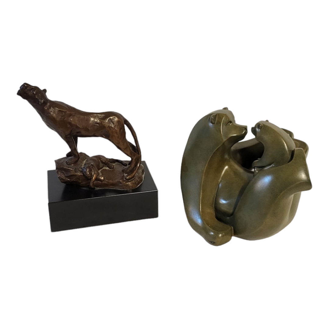 AN ART DECO STYLE PATINATED BRONZE GROUP OF LIONESS AND CUB Raised on a rocky base, bearing