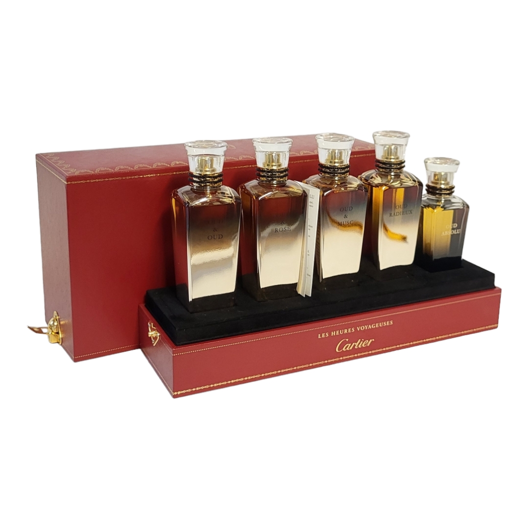 CARTIER, A CASED 'LES HEURES VOYAGEUSES' FIVE PERFUME BOTTLE SET Titled 'Oud and Oud, Oud and - Image 2 of 5