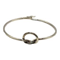 GEORG JENSEN, A VINTAGE DANISH SILVER BANGLES Single wire with knot, oval mark number A44C 925 (