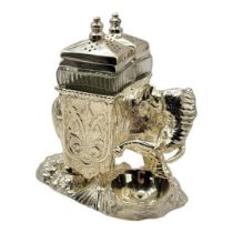 A SILVER PLATED ELEPHANT CRUET With two glass condiment bottles and a cast bowl shaped salt at the