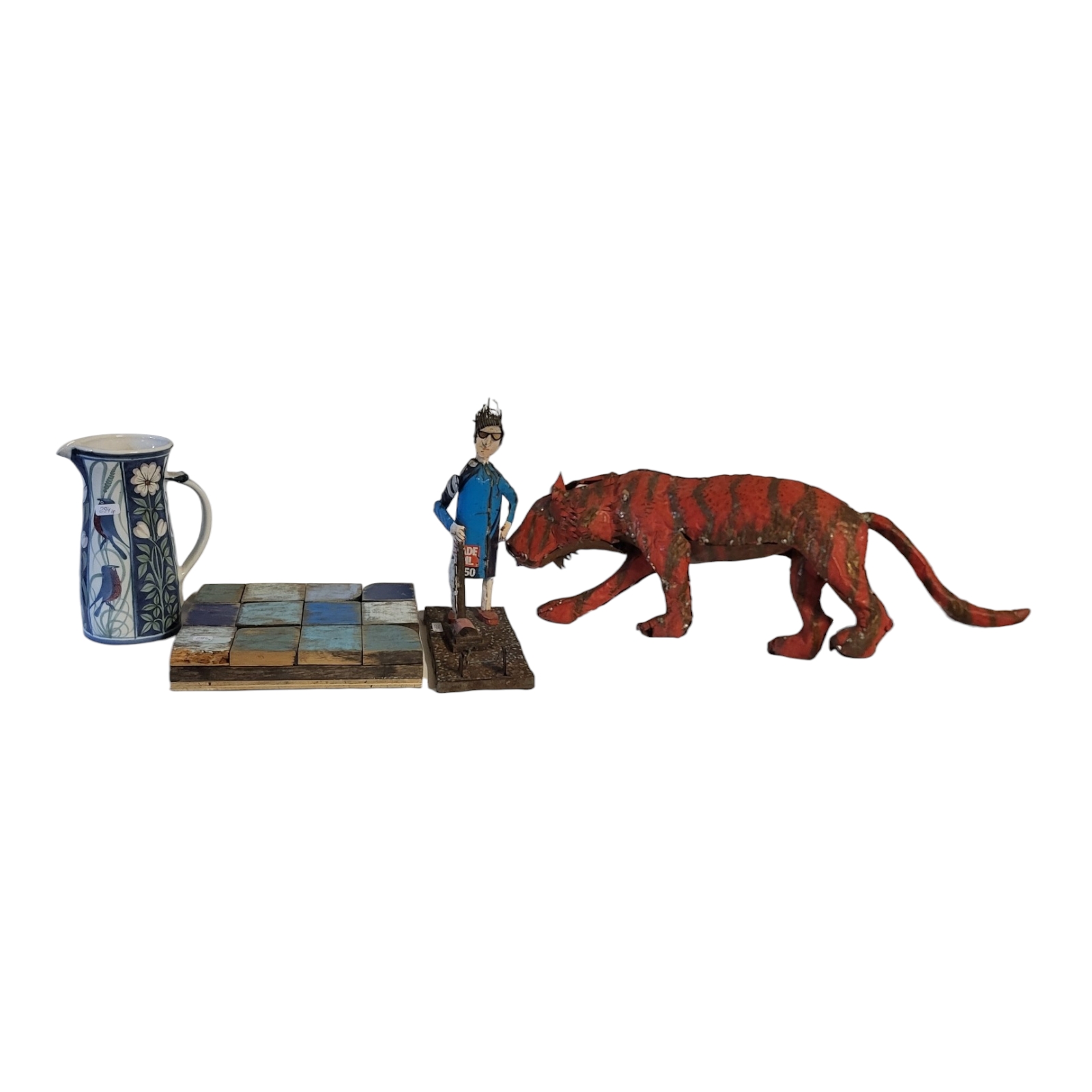 A LATE 20TH CENTURY HANDMADE TINPLATE MODEL OF A BENGAL TIGER Along with model of a housewife