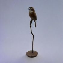 A JAPANESE SH?WA STYLE BRONZE SINGING BIRD Perched on a branch with impressed foundry mark on