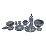 WEDGWOOD, A COLLECTION BLUE AND WHITE JASPERWARE Comprising an urn form lamp, salad bowl, twin