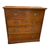 A VICTORIAN MAHOGANY CHEST Set with two short above three long drawers fitted with oval brass
