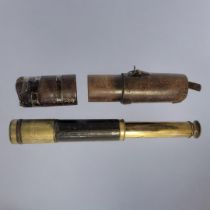 A 19TH CENTURY BRASS AND LEATHER TELESCOPE Three pull out and lens shade,black leather mount and