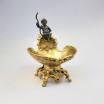 AFTER E. PROVOST, A 19TH CENTURY STYLE GILT AND BRONZE CHERUB SALT Figure perched in oyster shell