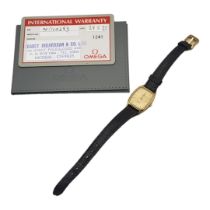 OMEGA DEVILLE, A VINTAGE GOLD PLATED LADIES’ WRISTWATCH Cream tone dial and black leather omega