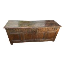 A 17TH CENTURY ELM AND OAK COFFER With arched frieze above four panels on stile feet. (135cm x