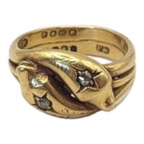 AN EARLY 20TH CENTURY 18CT GOLD AND DIAMOND SNAKE RING Entwined snakes set with round cut