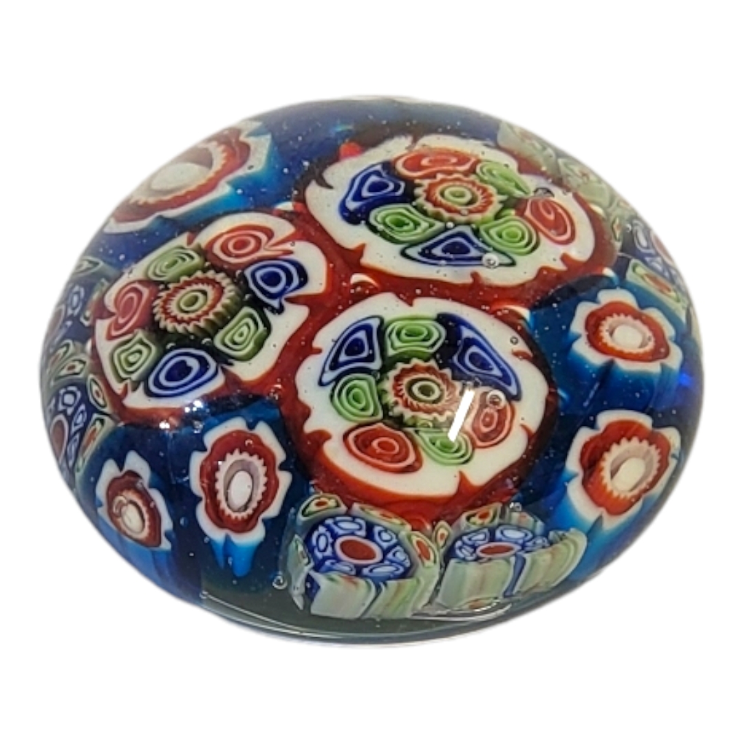AN ANTIQUE ST. LOUIS STYLE GLASS PAPERWEIGHT With central red and blue cogwheel design surrounded by