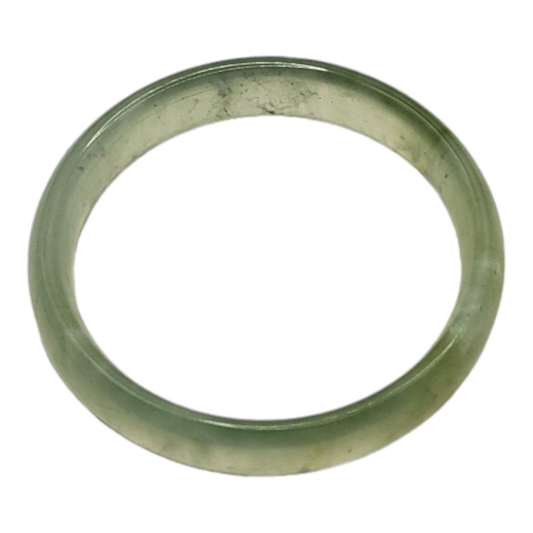 A PALE GREEN CELADON JADE BANGLE. (inside diameter 6cm) Condition: good overall
