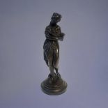 A 19TH CENTURY CONTINENTAL BRONZE FIGURE Classical form maiden with hand mirror, on black slate