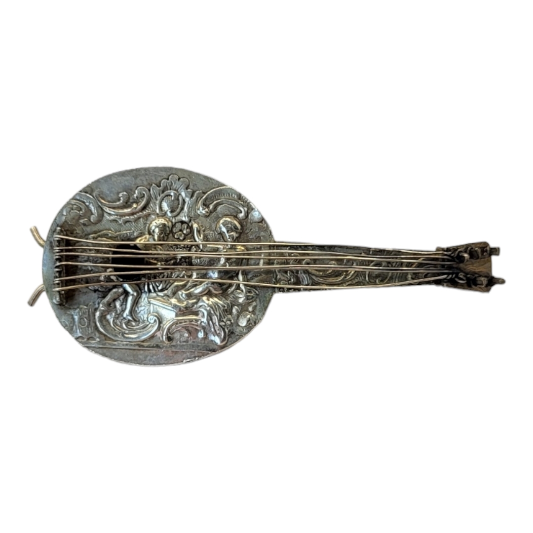 A VINTAGE CONTINENTAL SILVER NOVELTY MANDOLIN Having embossed figural decoration and scrolled - Image 2 of 3