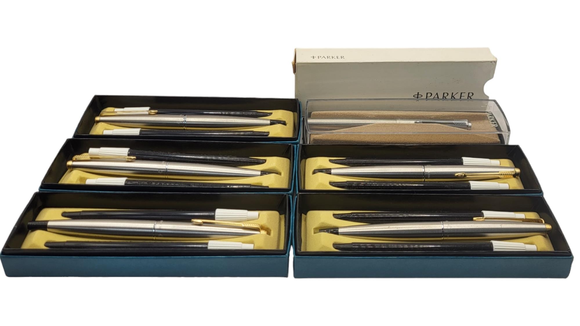 PARKER, A COLLECTION OF SEVEN VINTAGE GOLD PLATE AND STEEL SOFT TIP PENS Together with a cross