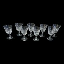 STUART, A SET OF EIGHT CUT LEAD CRYSTAL WINE GLASSES Each having cut decoration. (approx 12cm)