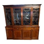 A MID 20TH CENTURY SHERATON REVIVAL MAHOGANY AND SATINWOOD BANDED BREAKFRONT WING BOOKCASE With four