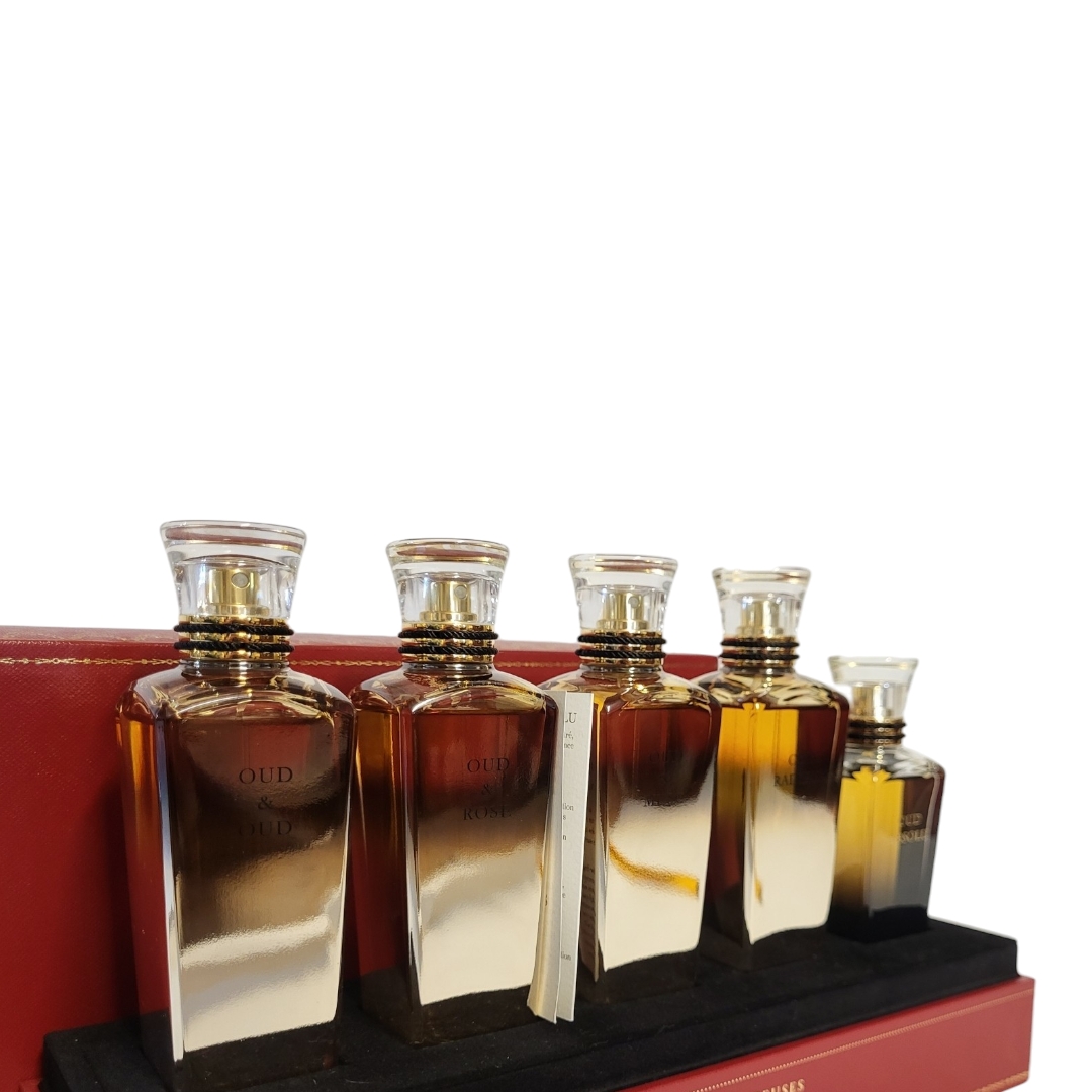 CARTIER, A CASED 'LES HEURES VOYAGEUSES' FIVE PERFUME BOTTLE SET Titled 'Oud and Oud, Oud and - Image 4 of 5