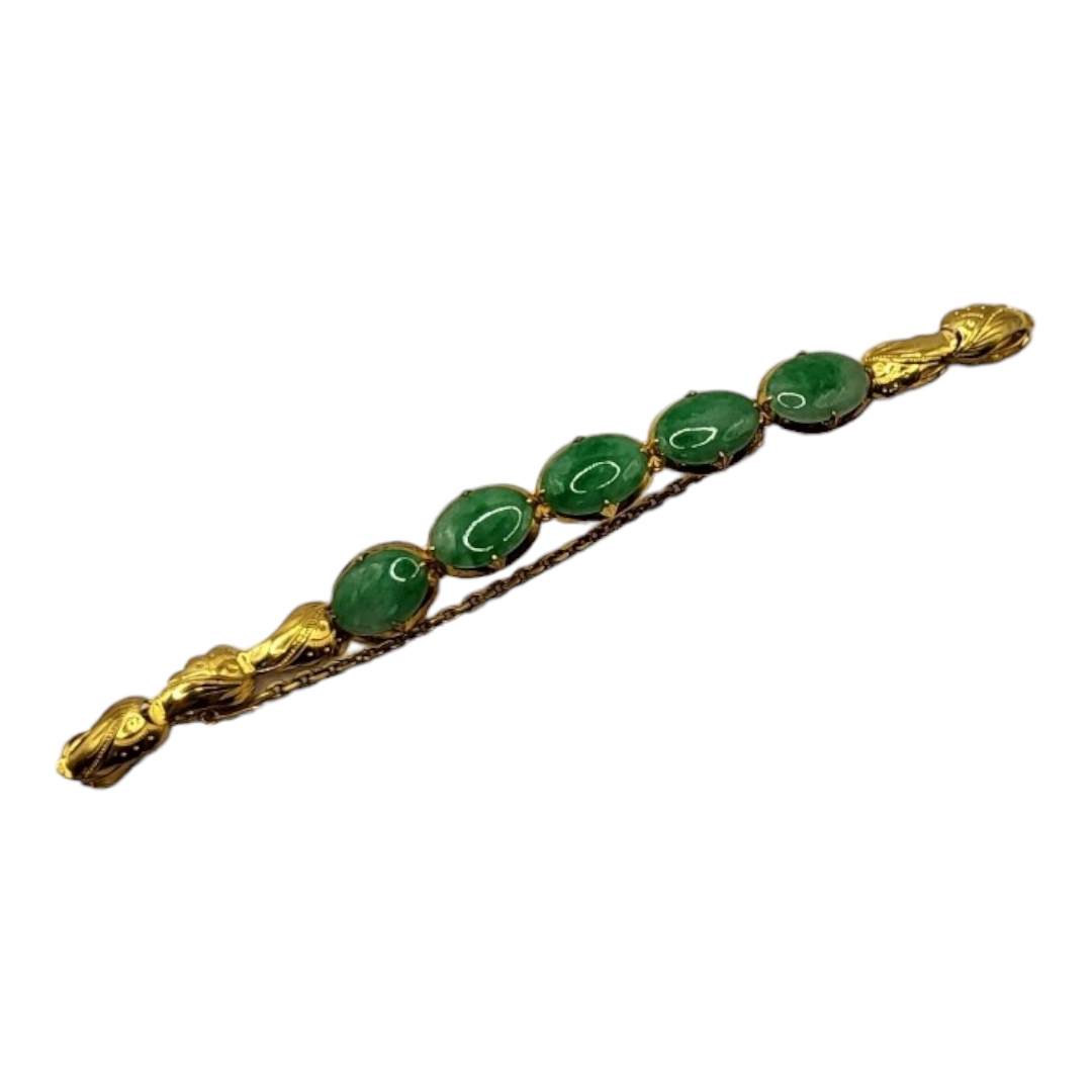 A VINTAGE CHINESE YELLOW METAL AND JADE BRACELET Five cabochon cut stones with scrolled yellow metal - Image 2 of 3