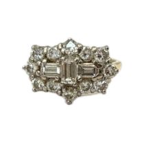 AN 18CT GOLD AND DIAMOND CLUSTER RING Three baguette cut diamonds central cruciform edged with