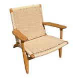 GETAMA, HANS J. WAGNER, DANISH, AN OAK OPEN EASY ARMCHAIR With caned seat and back. (70cm x 70cm x