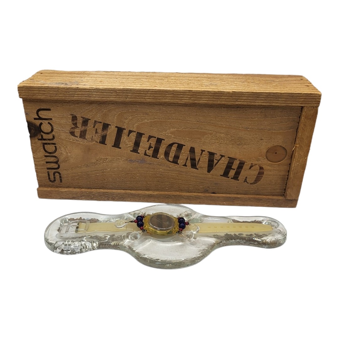 SWATCH, A VINTAGE CHANDELIER WRISTWATCH Set in glass frame with glass beads, in a fitted wooden box.