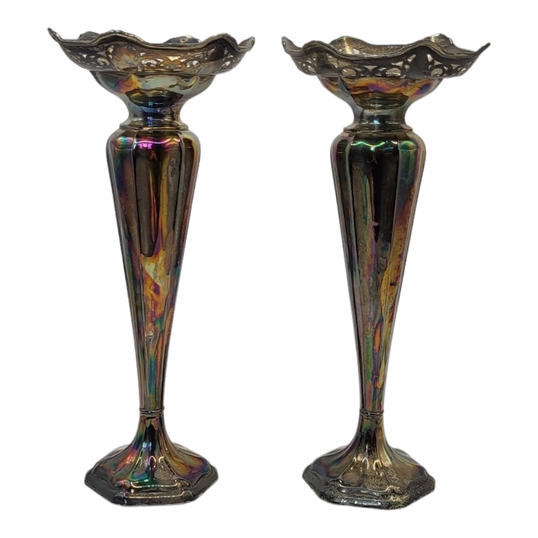 A PAIR OF EARLY 20TH CENTURY SILVER BUD VASES With pierced rim on fluted body and weighted base,