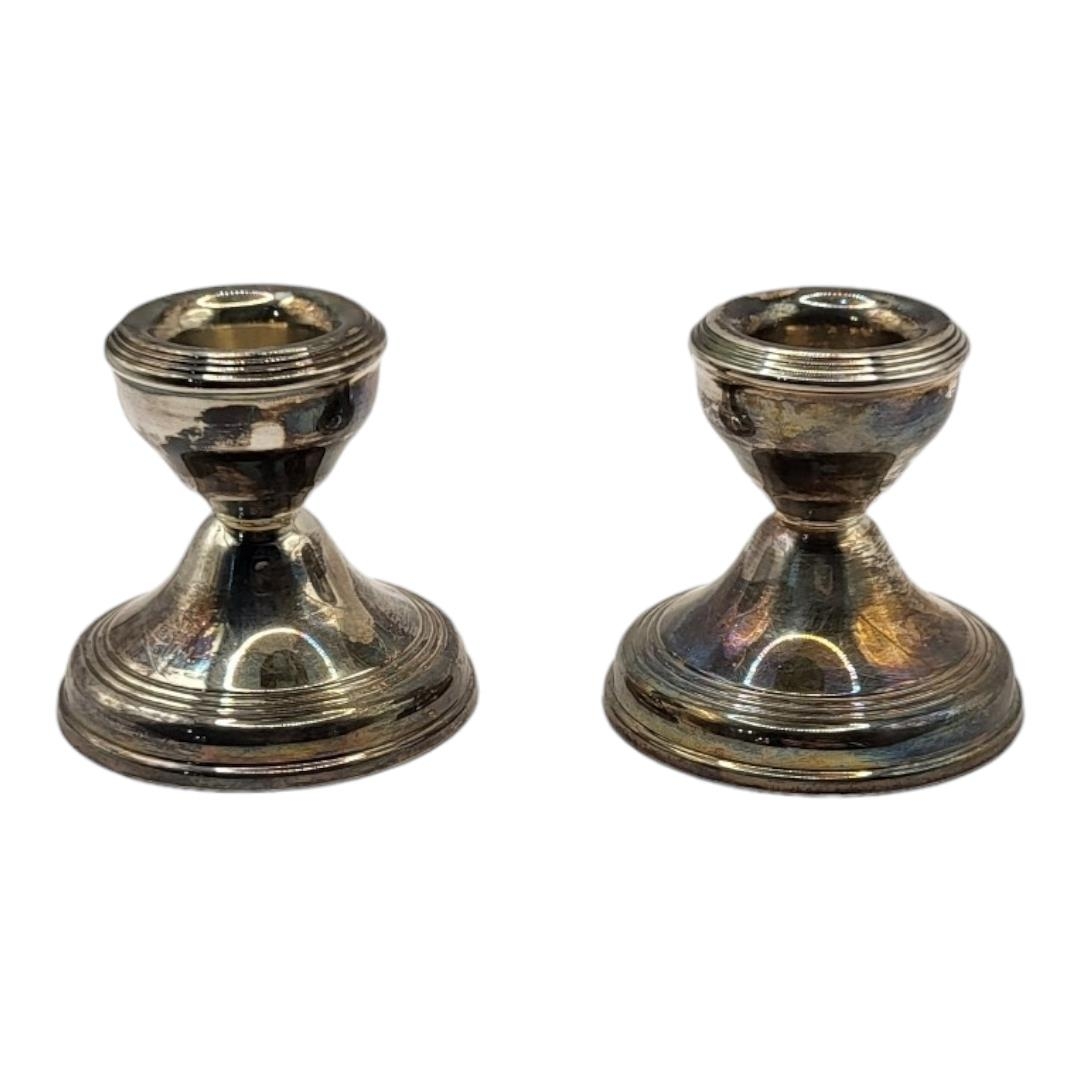 A VINTAGE PAIR OF SILVER SQUAT CANDLESTICKS On a circular base, hallmarked Birmingham, 1965. (approx