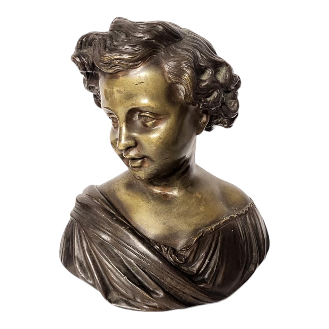 A LATE 19TH CENTURY FRENCH PATINATED BRONZE BUST OF L’AMOUR, A YOUNG GIRL WITH CURLY HAIR AND