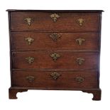 AN EARLY 18TH CENTURY OAK CHEST OF FOUR LONG DRAWERS Fitted original brass furniture, on bracket