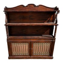 A WILLIAM IV PERIOD ROSEWOOD BOOKCASE With serpentine shaped top rail above open shelves supported
