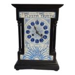 A FINE ENGLISH AESTHETIC MOVEMENT EBONISED WOOD AND MONOCHROME PAINTED ENAMEL FACE IN THE STYLE OF