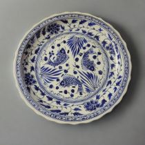 A LARGE CERAMIC CHINESE BLUE AND WHITE CHARGER Decorated with Koi fish and a floral border. (57cm)
