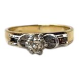 A VINTAGE 18CT GOLD DIAMOND SOLITAIRE RING The central round cut stone set in a raised mount, in a