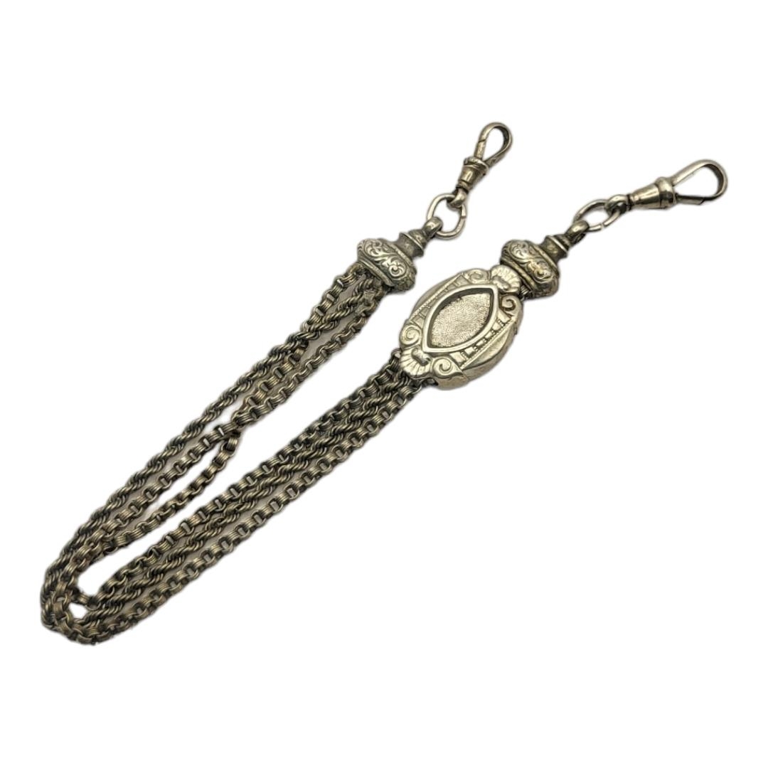 A VICTORIAN WHITE METAL ALBERTINA WATCH CHAIN Having engraved decoration and oval form slider. ( - Image 2 of 2