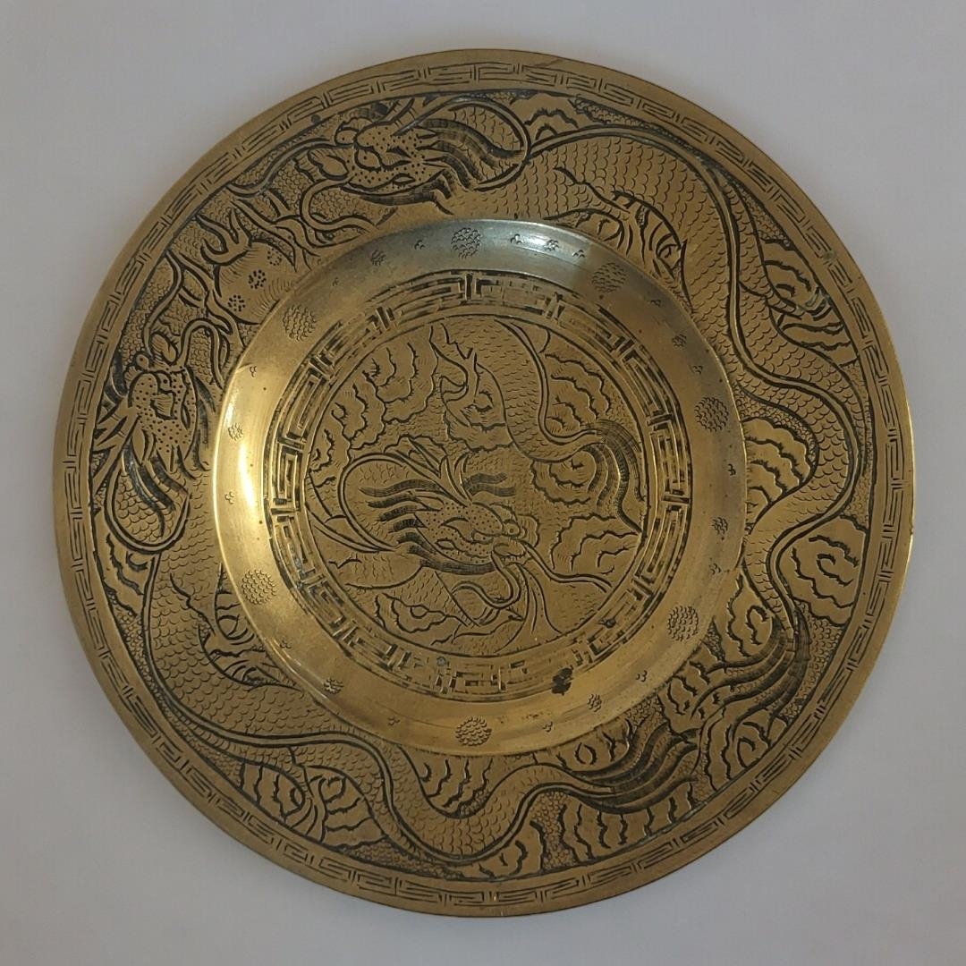 A CHINESE BRONZE 'DRAGON' CHARGER DISH Having engraved decoration of dragons, cast six character