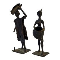 A PAIR OF CAST BRONZE NATIVE TRIBAL NOMADIC FIGURES OF FARMERS (POSSIBLY CENTRAL AFRICAN). (