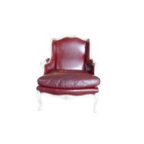 A FRENCH LOUIS XVI DESIGN CARVED WOOD AND PAINTED RED LEATHER WINGBACK ARMCHAIR The shaped back