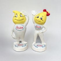 A PAIR OF NOVELTY CAST IRON ESSO MONEY BANK FIGURINES Titled ‘Abby Slick’ & ‘Andy Slick’, with