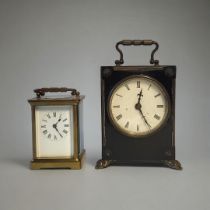 AN EARLY 20TH CENTURY GILT BRASS CARRIAGE CLOCK Having a single carry handle and four bevelled glass