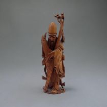 A LATE 19TH CENTURY CHINESE QING DYNASTY HARDWOOD CARVING, SHOU LAO IMMORTAL In traditional long