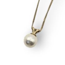 A VINTAGE YELLOW METAL AND PEARL NECKLACE The single pearl on a fine link chain. (pearl 0.7cm)