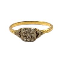 AN EARLY 20TH CENTURY YELLOW METAL AND DIAMOND CLUSTER RING Having an arrangement of nine round